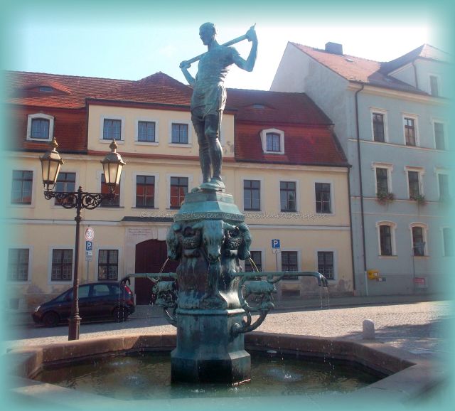 Brunnen mit Fleischerfigur aus Bronze